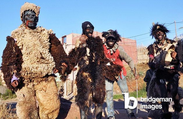 An ancestral custom of Berber Morocco, the Boujloud takes place a few days after the celebration of Aid al-Adha or Aid al-Kabir (Fete of Sacrifice) - Young men and boys coat themselves with the skin of sacrificed sheep and pursue passers-by by hitting them with the feet of animals if they do not give any money. Various masks and disguises blend in at Boujloud, assimilating this tradition to that of carnival or halloween - Ait-Ourir Region, near Marrakech, November 2013 - Photo Patrice Cartier - / Photo © Gusman / Bridgeman ImagesHalloween