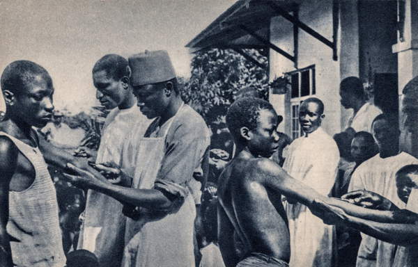 photograph of Catholic Missionaries Administering Vaccinations, Africa, Africa, c.1920 (postcard) / Private Collection / The Burns Archive and Museum of Historical Photography / Bridgeman Images