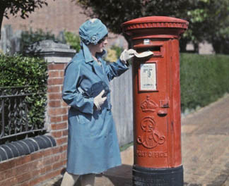 A young woman mails a letter at the pillar box, Oxford, 1928 (autochrome) by Clifton R Adams (fl.c. 1930) National Geographic Image Collection