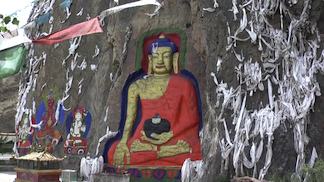 Blue Medicine Buddha on Rock face on the way to Drolma Lhakhang, Tibet  